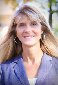 Headshot of Virginia Uhley, Ph.D. wearing a blue blazer