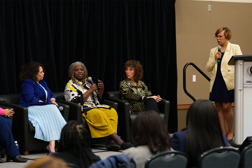 An image of a panel being moderated by Sophia Nelson