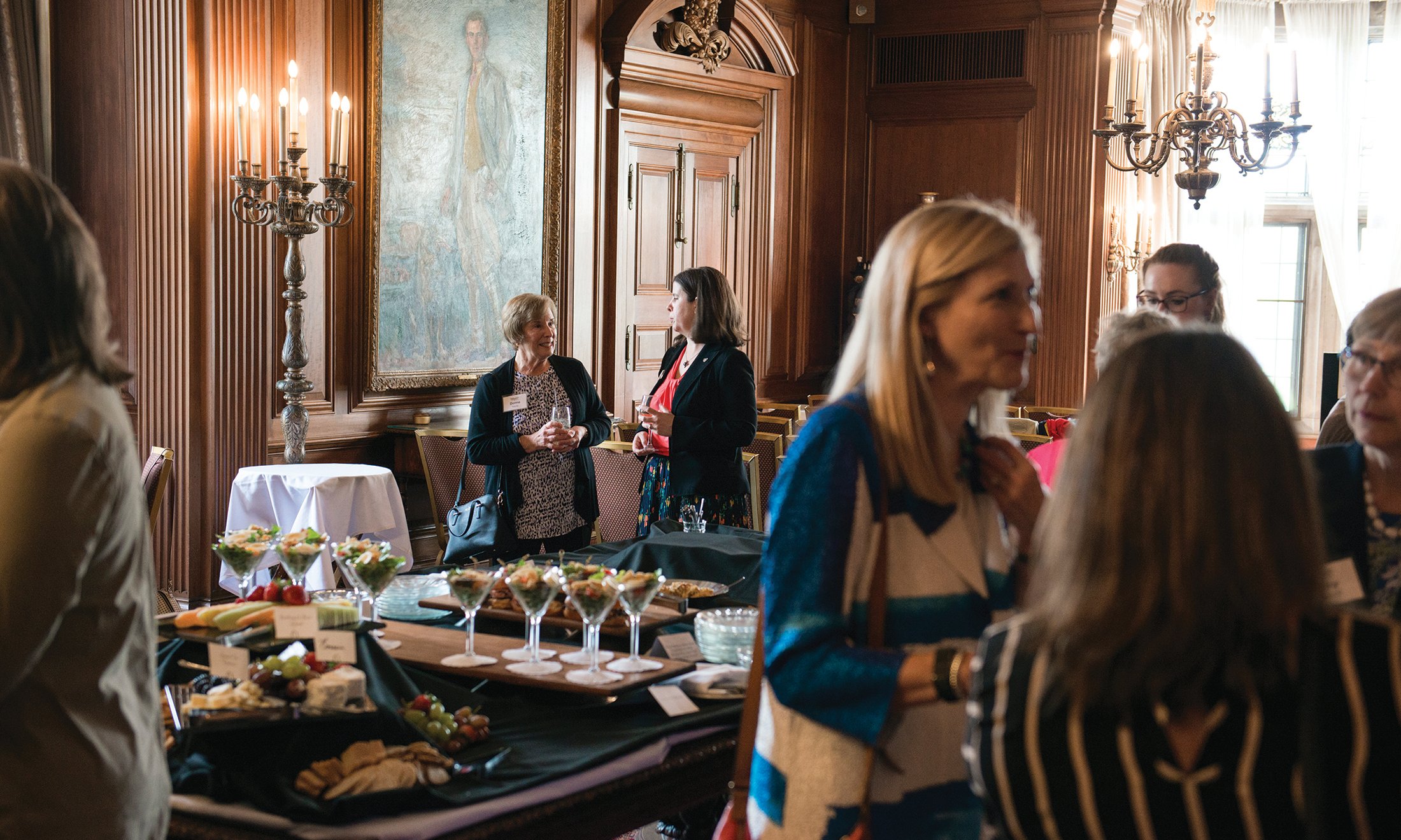 Group mingling during Women in Philanthropy luncheon at Meadow Brook Hall