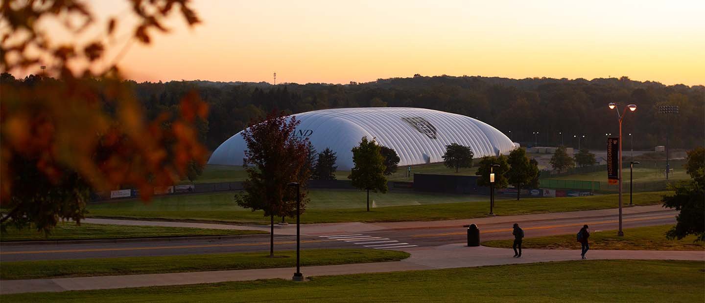 The exterior of the white Oakland University athletic dome.
