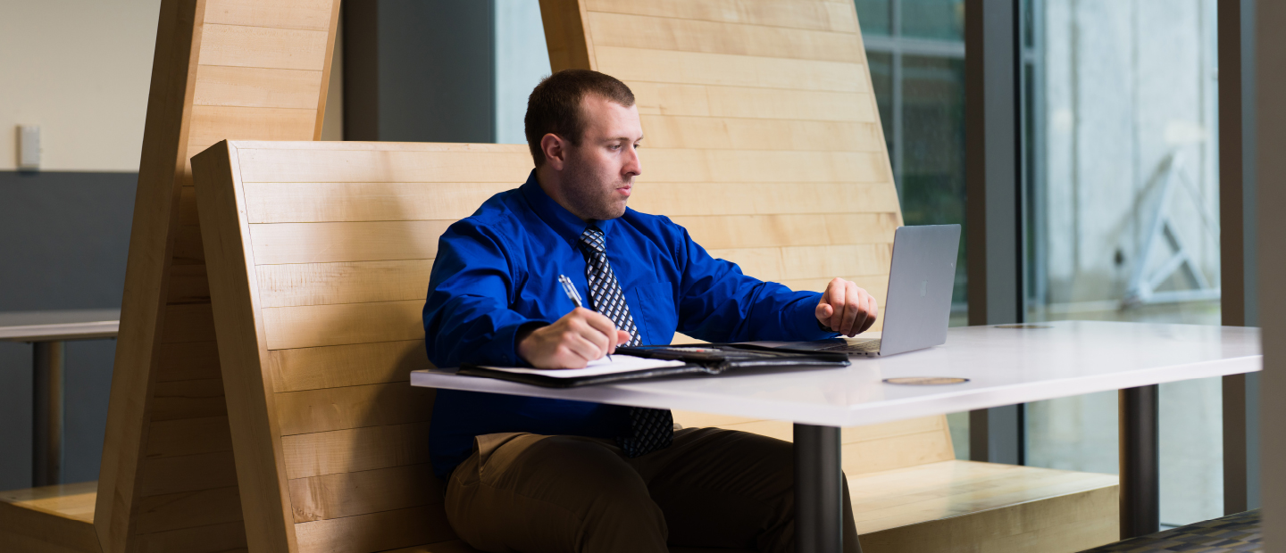 Student typing on laptop in the Engineering Center