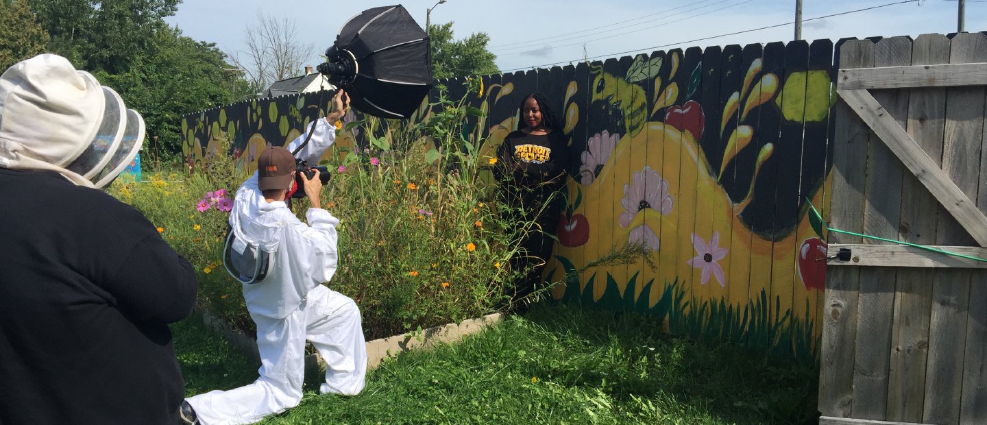 Behind the scenes shot of a photography shoot in a garden.