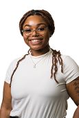 OU Business Scholar Kayla Reddic, Black female college student wearing white shirt, smiling for camera in professional headshot