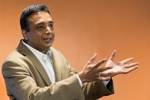 Ranadeb Chaudhuri, Ph.D. gesturing with his hands