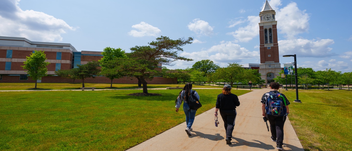 Students walking on campus with Elliott Tower 