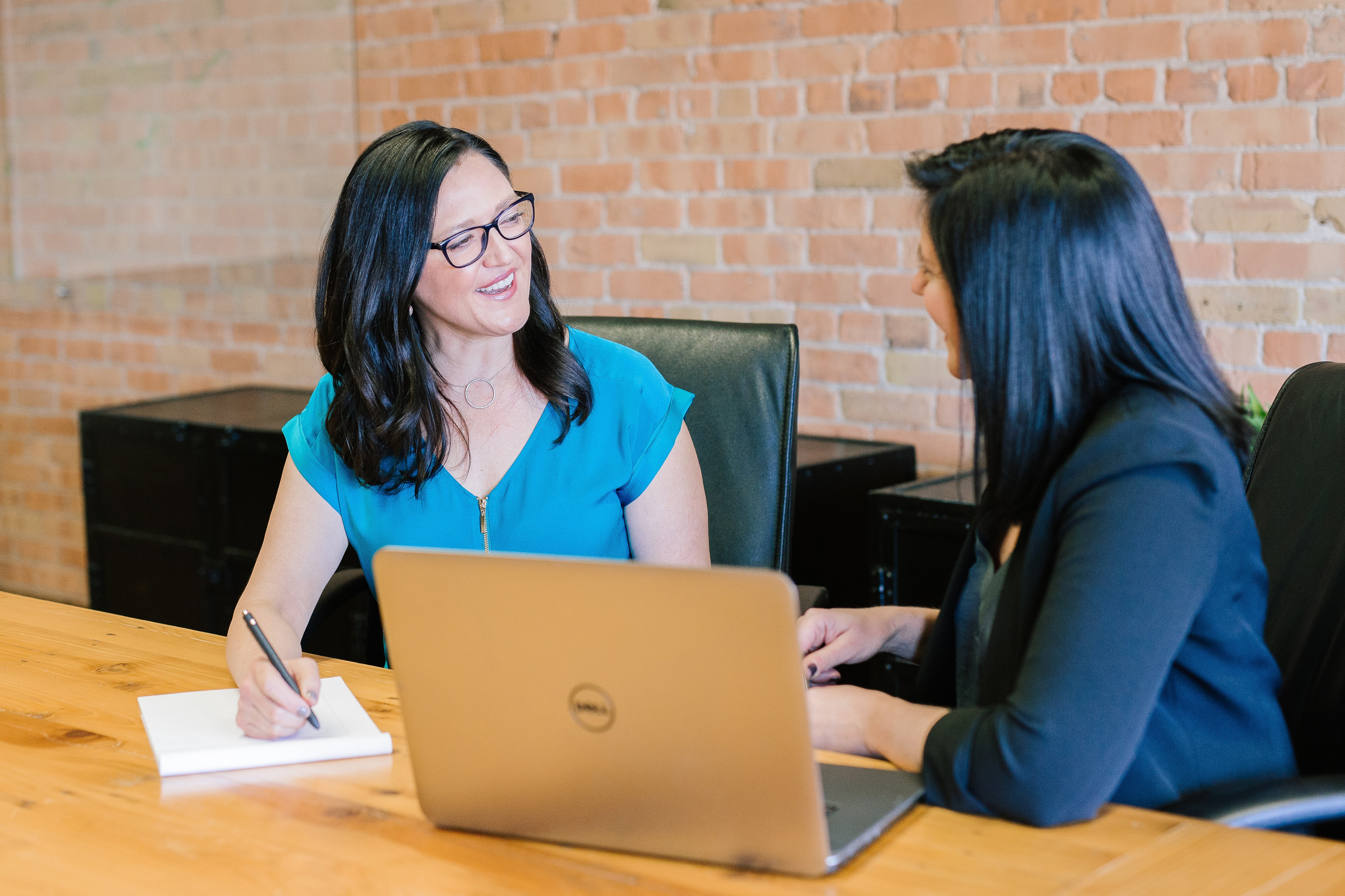 Two women talking at a table