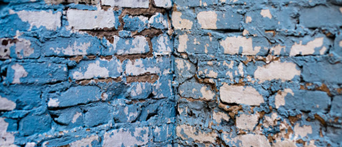 brick wall with blue paint