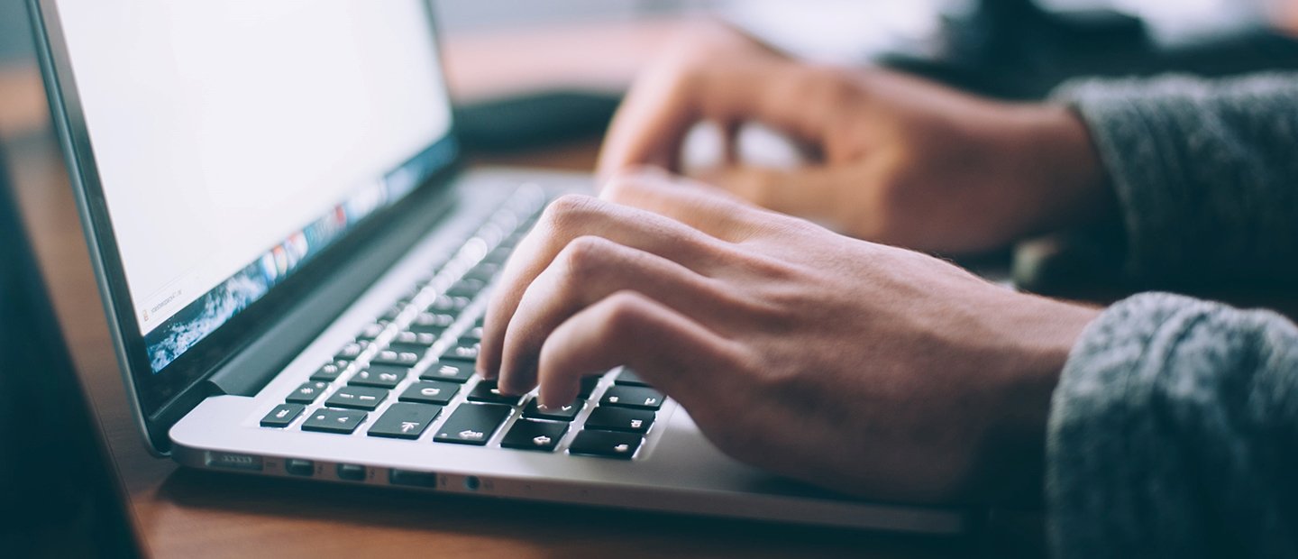 Class-Sourcing-Interaction-Online-Agendas-Notes-Discussions.jpg typing on a laptop