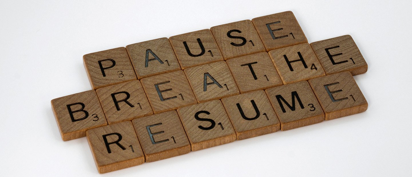Scrabble tiles with the words, pause, breathe, and resume