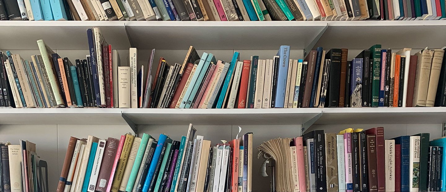 Three shelves full of books.