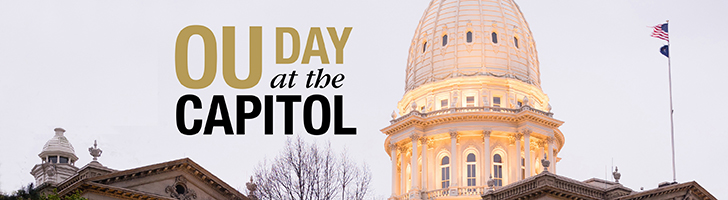image of the top of the State of Michigan capitol building with the text "OU Day at the Capitol"