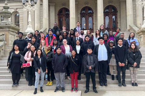 Participants of the OU Day at the Capitol event posing for a photo on the steps of the capitol building.