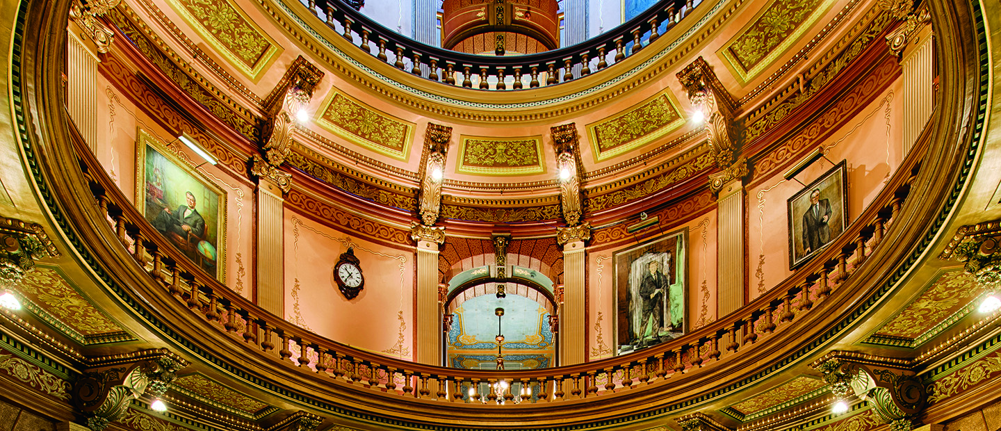 An image from the ground, looking up at the decorative ceiling of the Michigan capitol building.