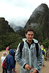 Juan Martin Davila Grijalva posing for a photo in front of Machu Picchu.