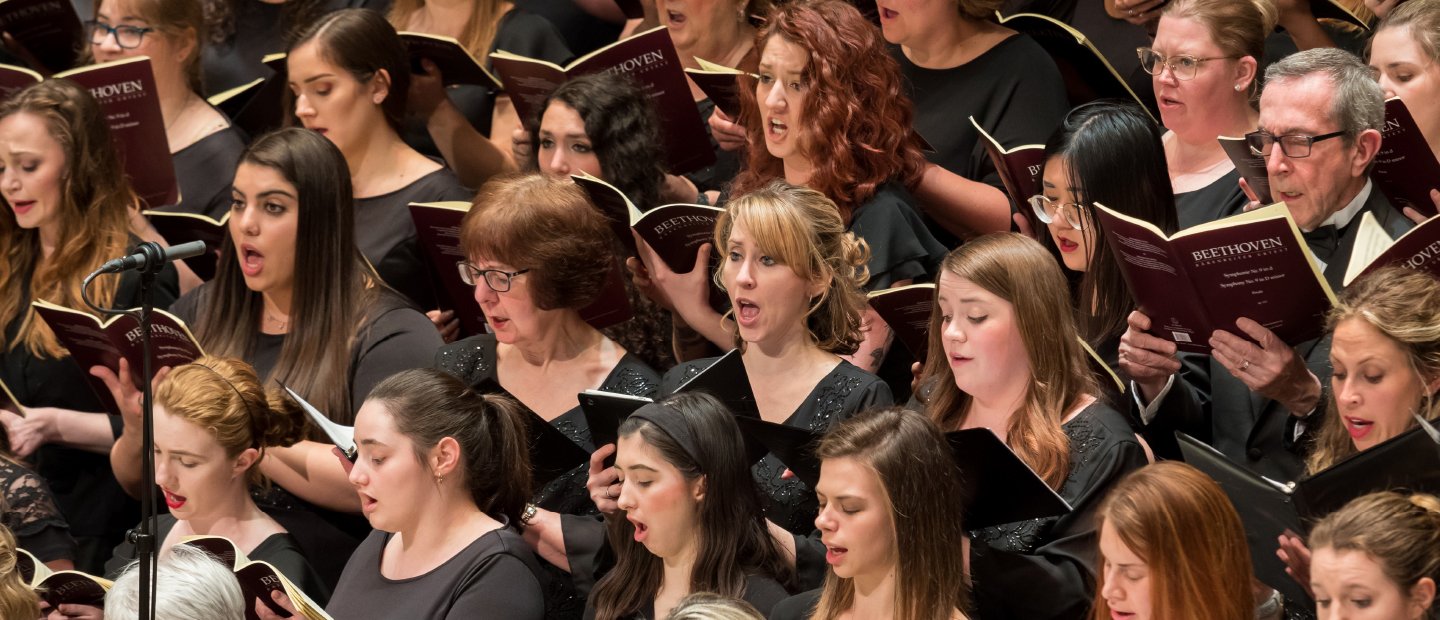 Singers in a chorale performing.