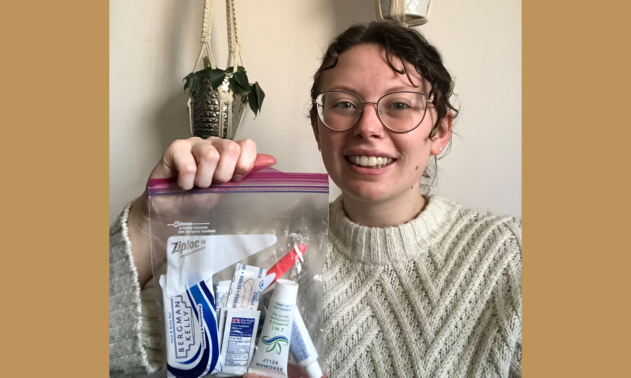An image of a student holding one of the hygiene kits