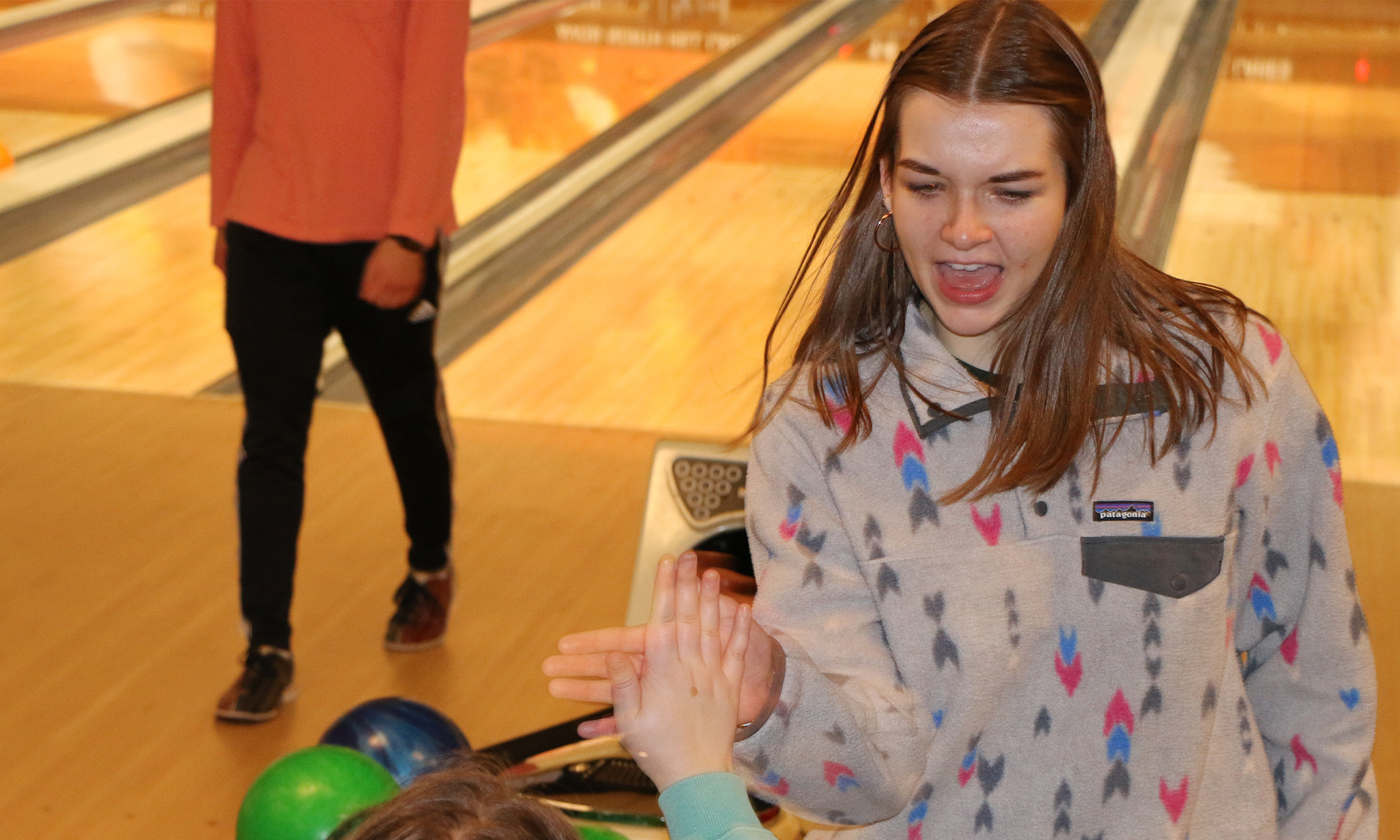 An image of OUWB students bowling and celebrating