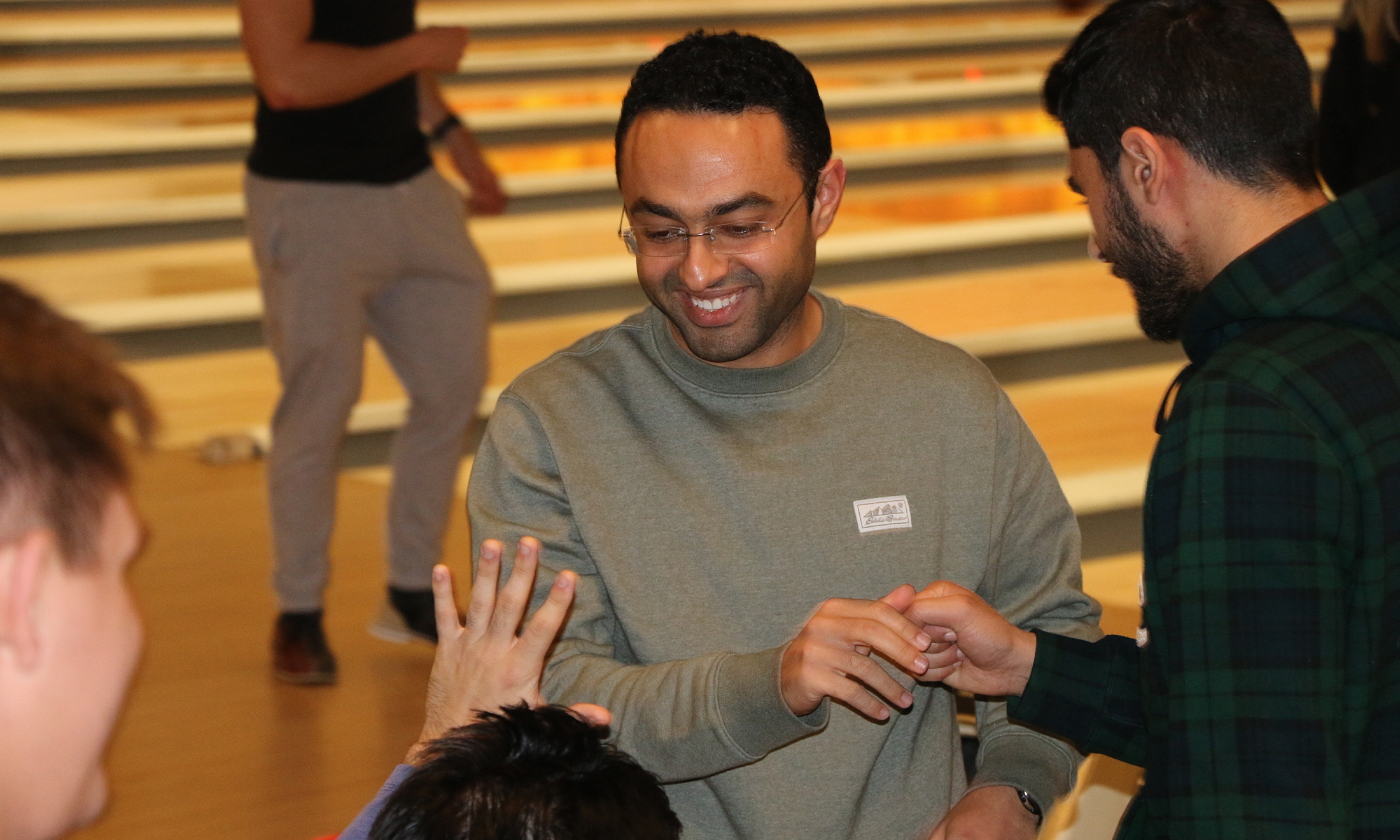 An image of OUWB students bowling and celebrating