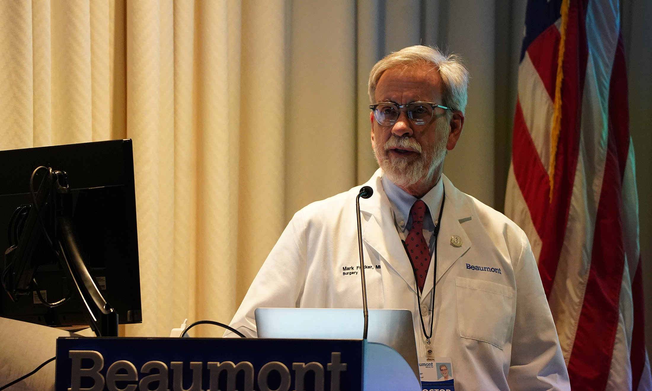 An image of Dr. Mark Frikker giving opening remarks