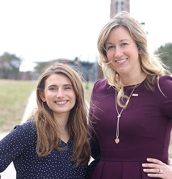 Two women posing. 