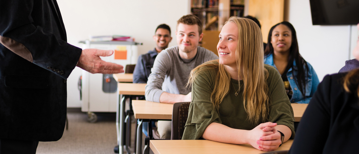 LeanBanners_2_AcademicPrograms Photo of a female student sitting at a desk