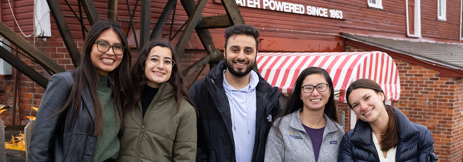 An image of students at an area cider mill