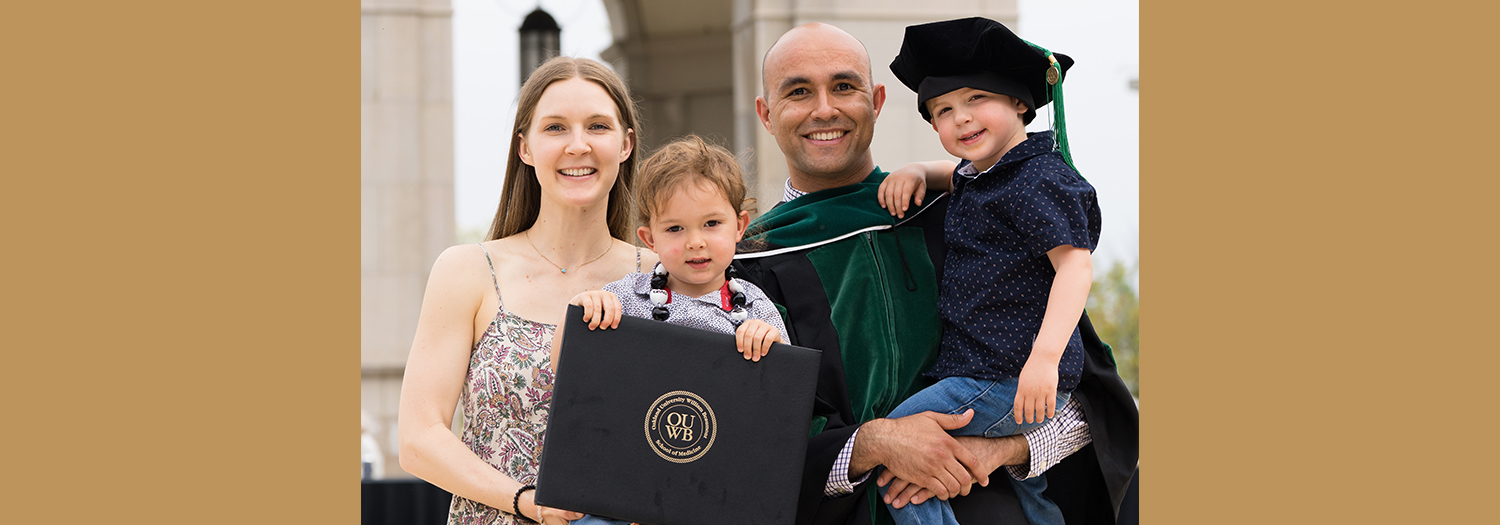 An image of an OUWB graduate and his family