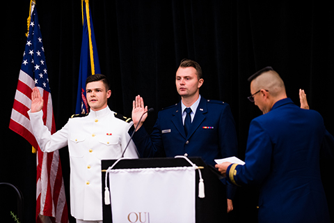 Recent medical student graduates, Dr. Kyle Eaton and Dr. Scott Myers earn their military promotion during Honors Convocation