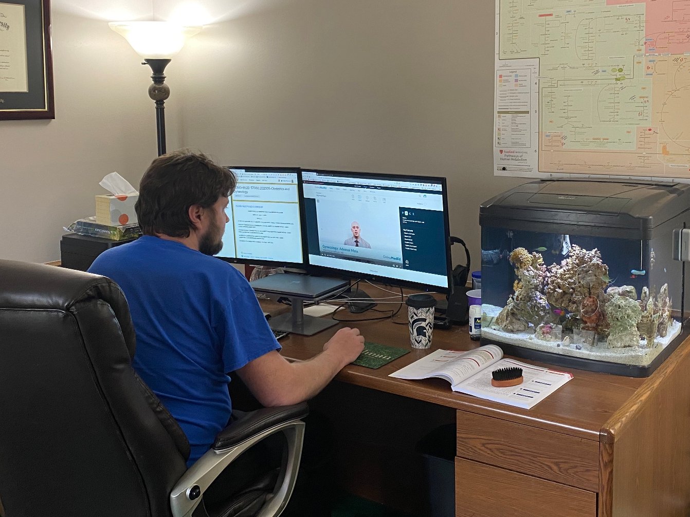 An OUWB student studies in his home office.