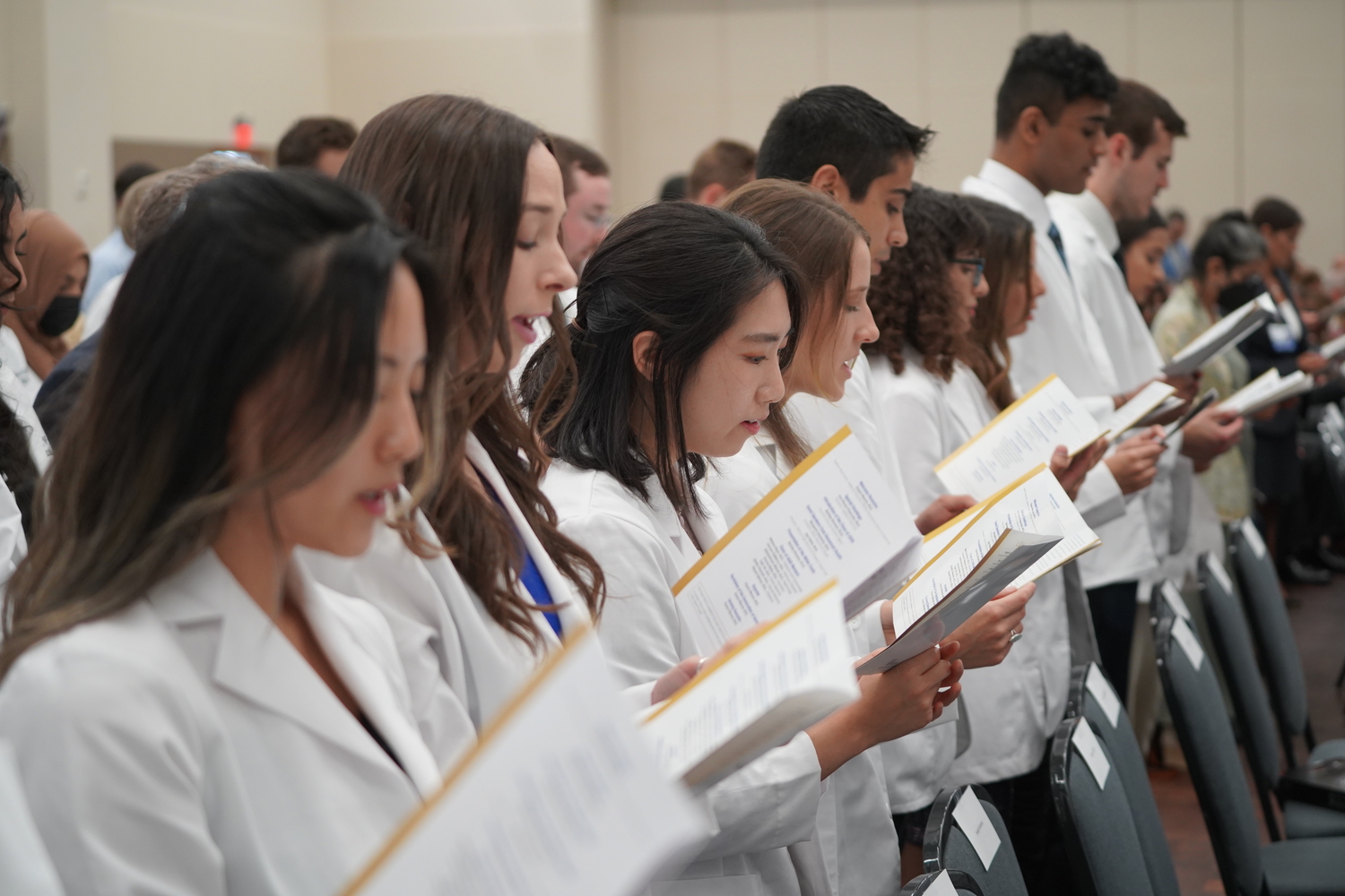 An image of students reciting the Oath of Geneva