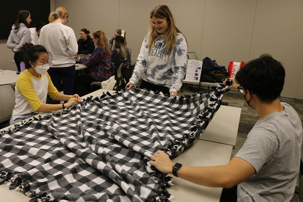 An image of students making a blanket