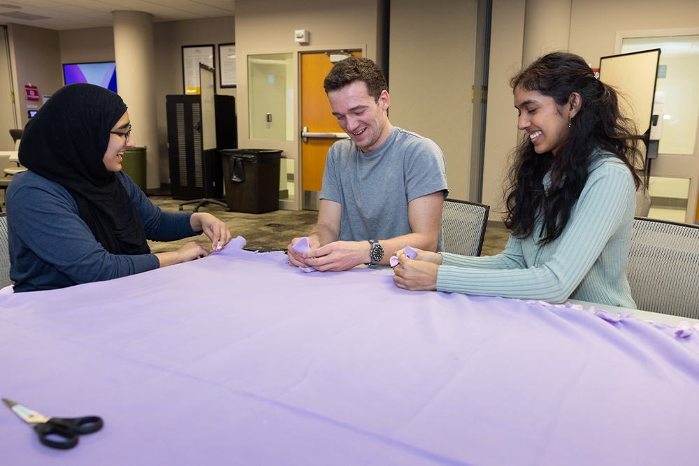 An image of OUWB students making blankets