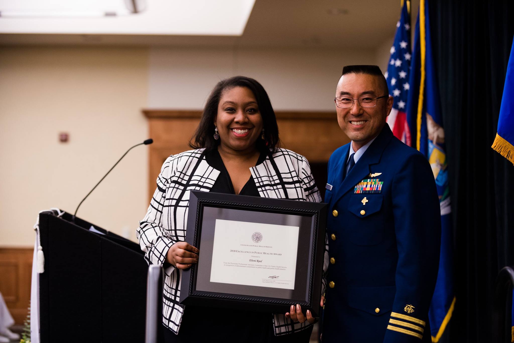 Student accepted framed award at Honors Convocation.