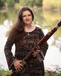 Stacey Jamison holding a bassoon.