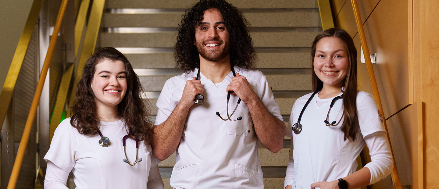 Undergraduate Programs students wearing white lab coats
