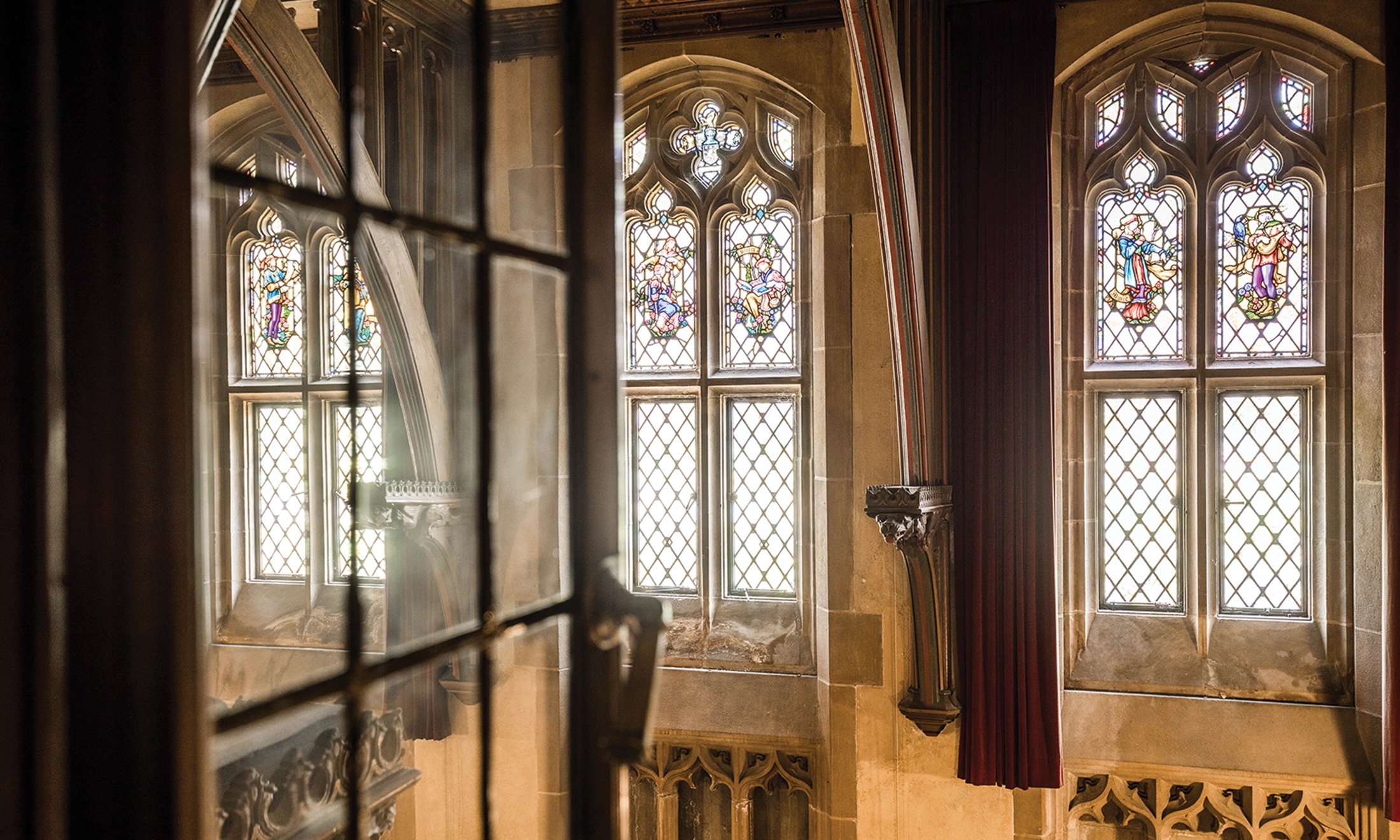 An interior view of the stained glass windows inside Meadow Brook Hall