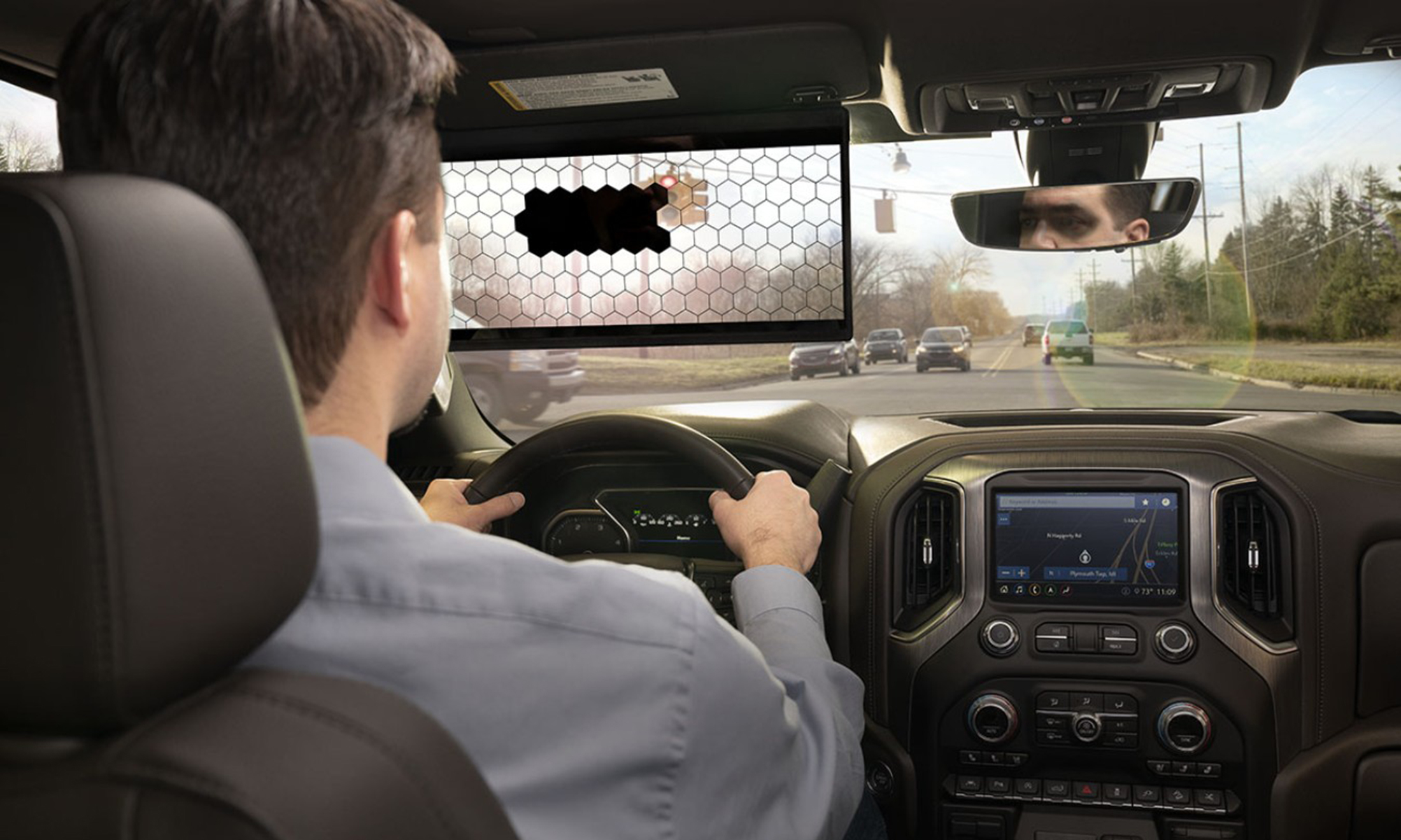 A man driving while using a Virtual Visor.