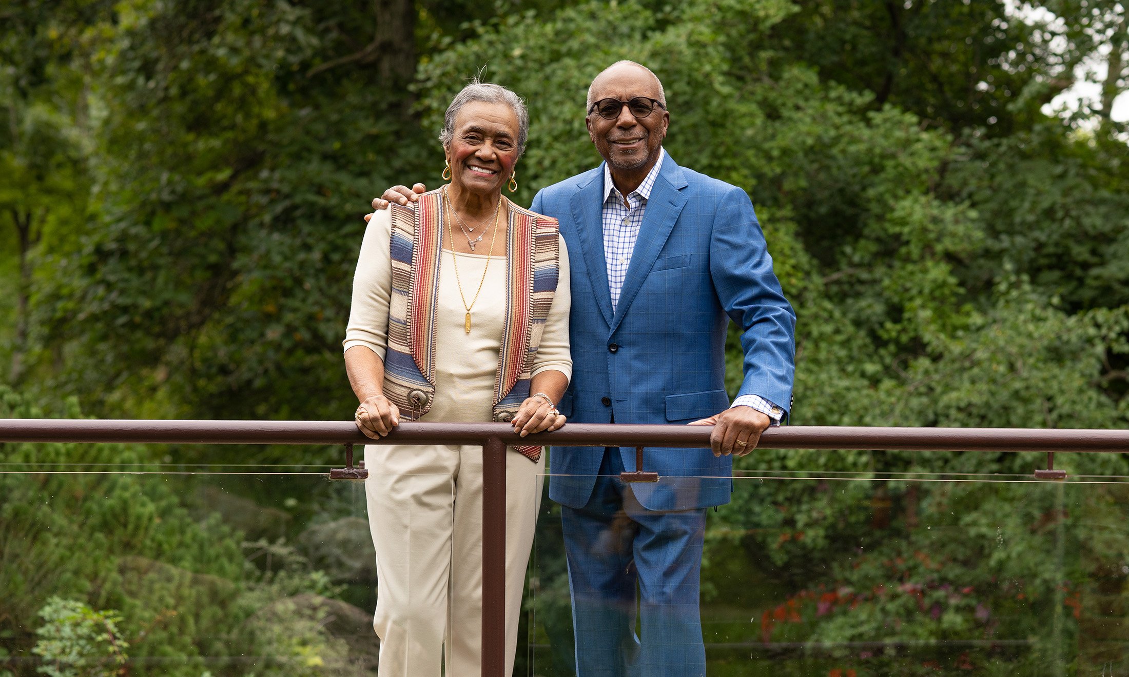 Man and Woman standing on bridge