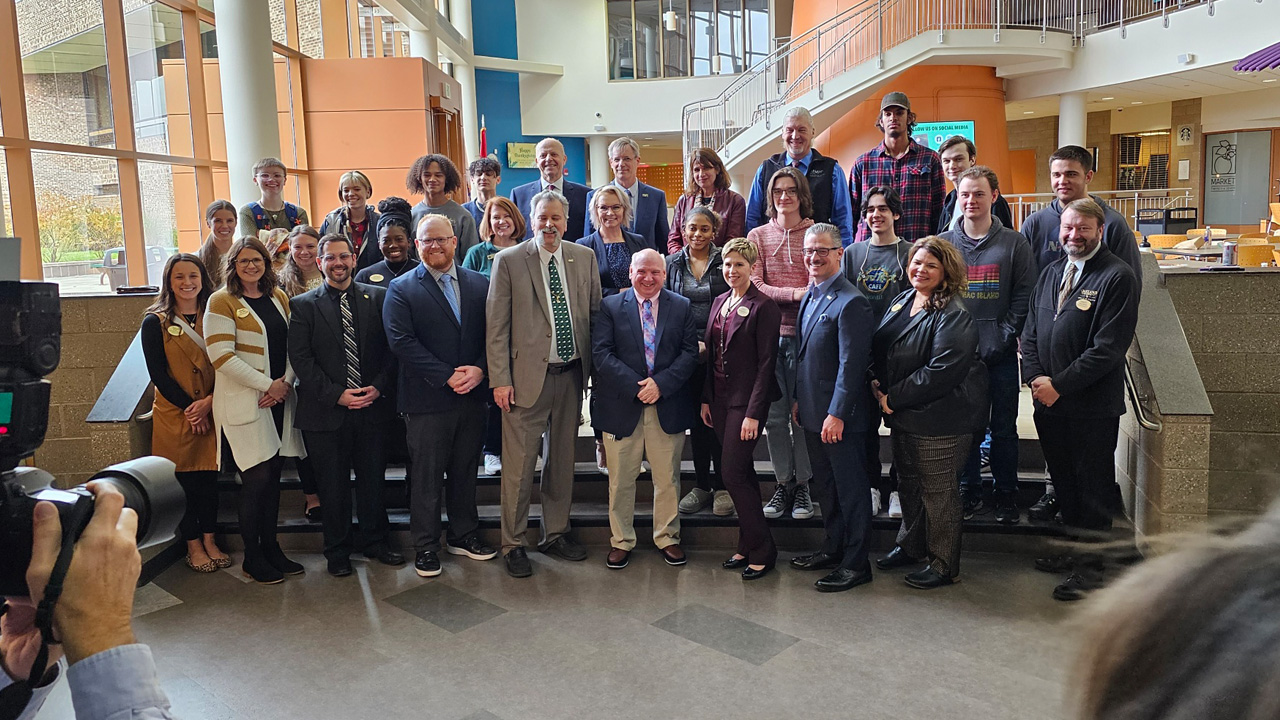 Group photo at transfer agreement signing