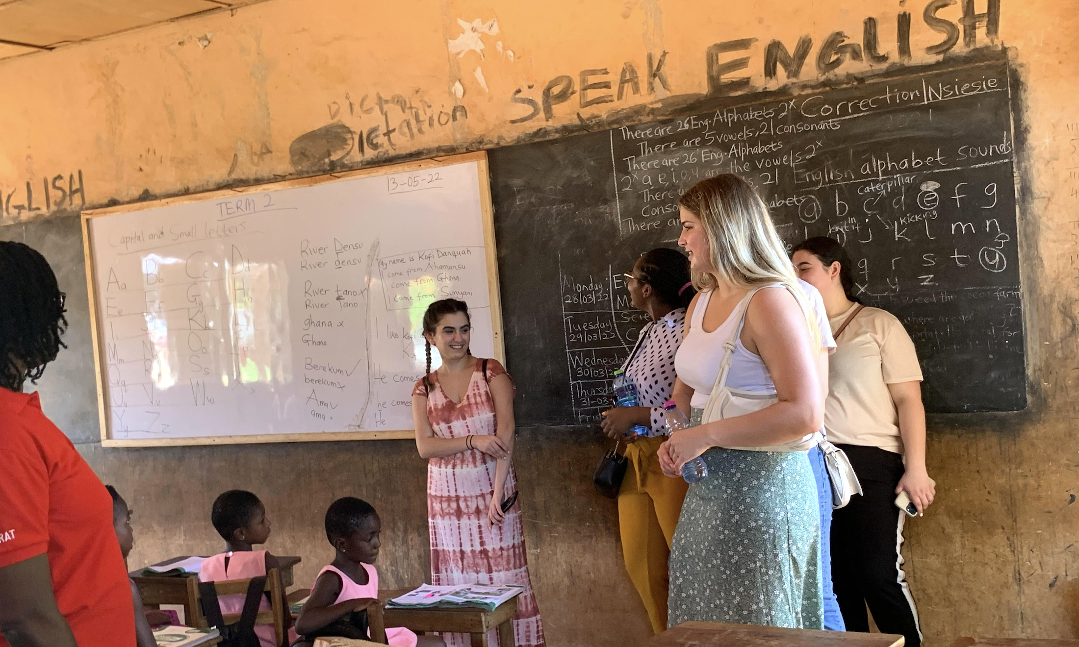 Oakland University students teach children in Africa.