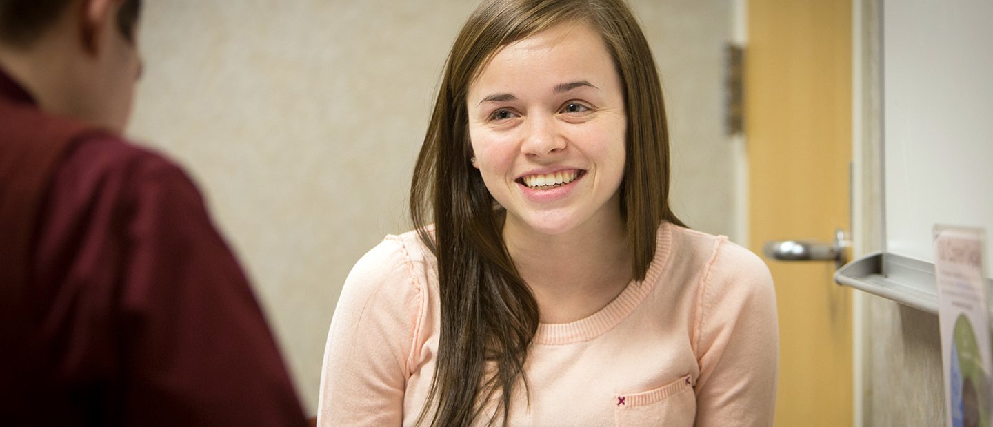 A young woman being interviewed.