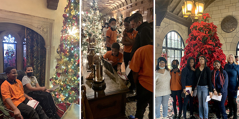 Students from Weston Preparatory Academy in Meadow Brook Hall, which is decorated with Christmas trees.