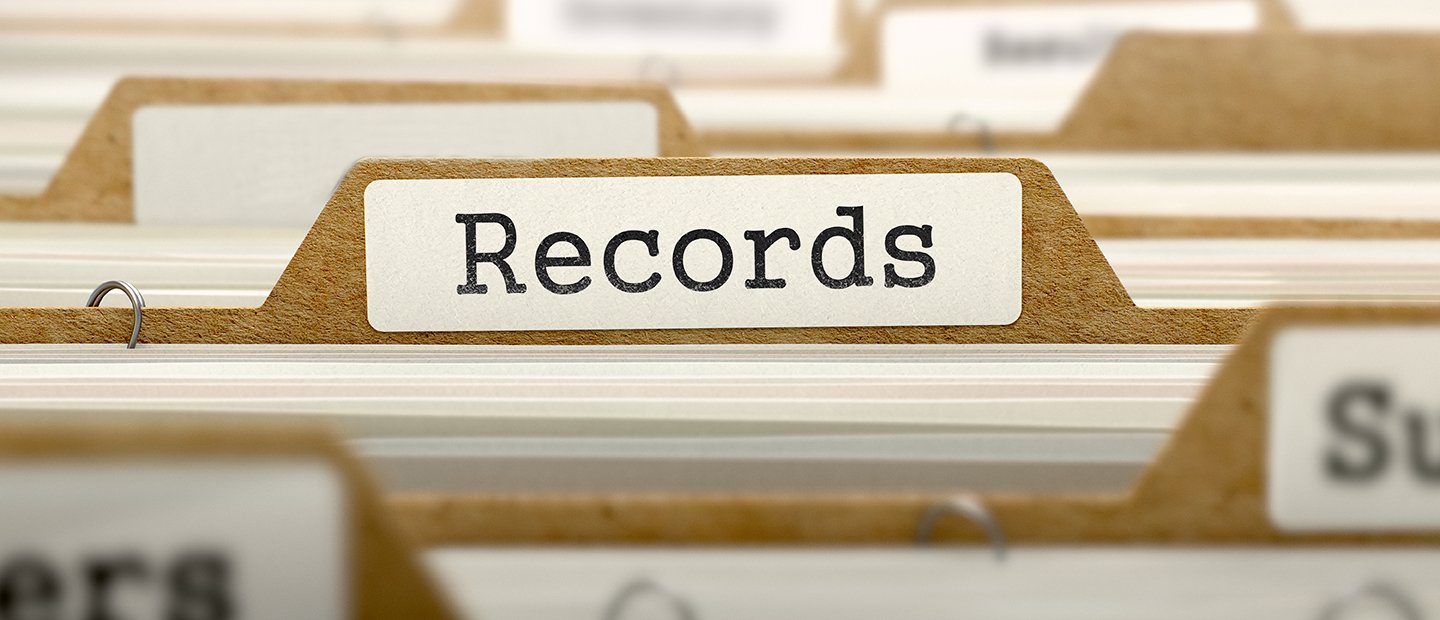 A file folder labeled "Records" in a row of folders.