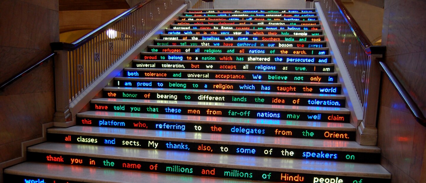 A staircase with electronic words scrolling across the front.
