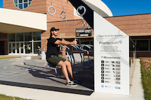 image of a person using the outdoor fitness center at Rec Well