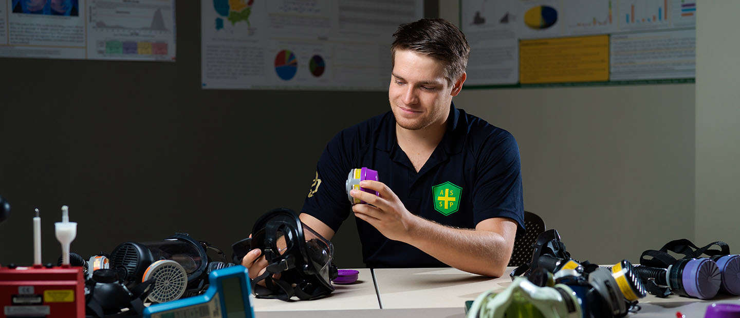 image of Ryan Papiernik working with environmental health and safety devices in a classroom