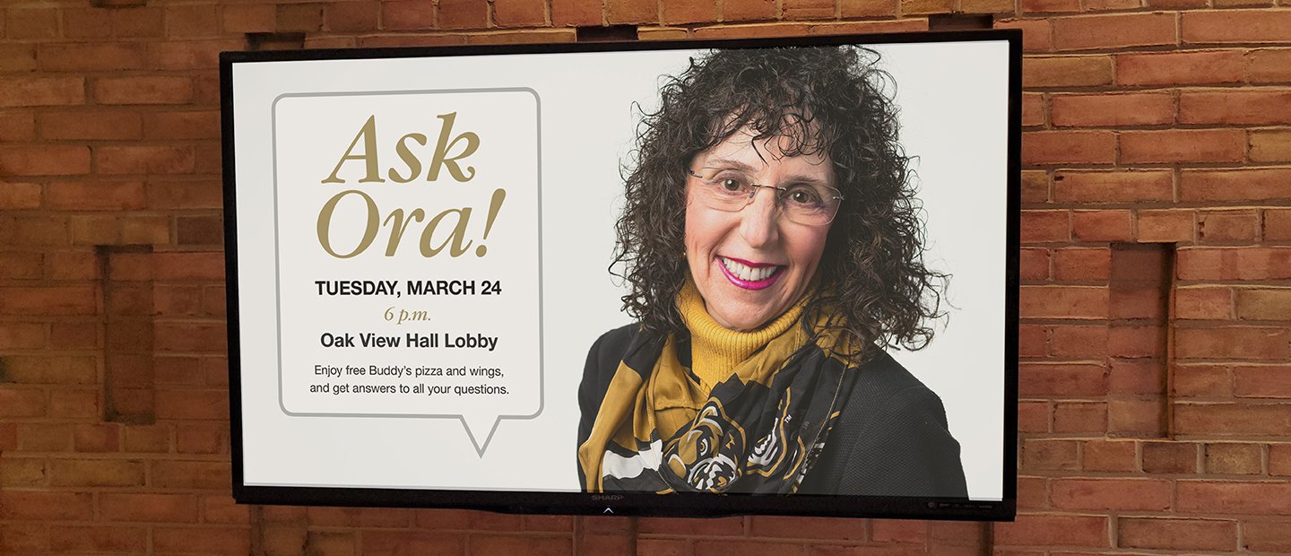 Television screen with a photo of Ora Hirsch Pescovitz and details about an event titled "Ask Ora!"
