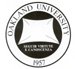 Round Oakland University seal with text on the outside and a white with the words 