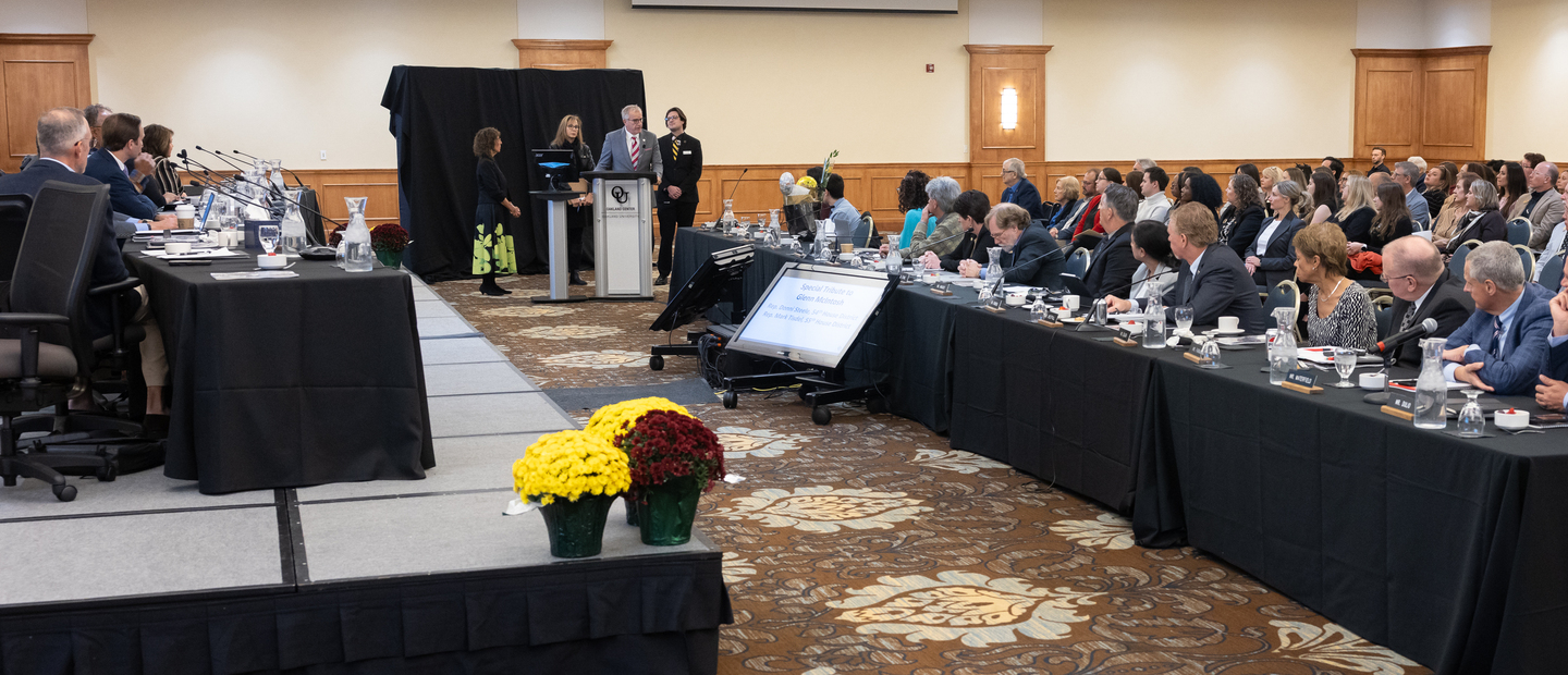 People at a board meeting at Oakland University