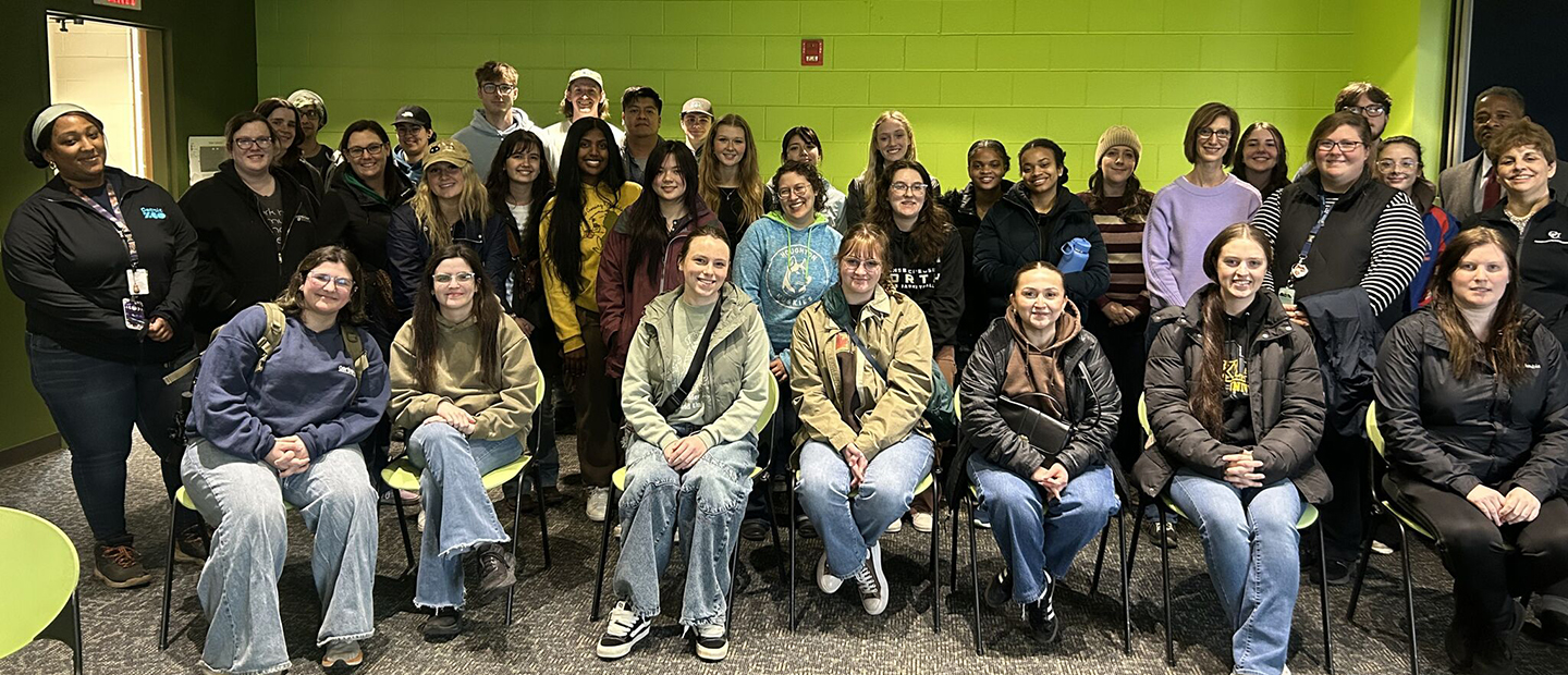 A large group of BioJourney students pose for a photo.